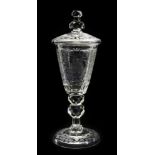 ENGRAVED GOBLET  Bohemia, 19th century. Conic goblet with lid on thin squared leg with double
