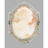 BROOCH WITH CAMEO  Oval cut in a shell with girl’s bust motif, set in fine mounting in Art Nouveau