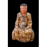 SITTING BUDDHA  China, late Ming dynasty (1368–1644). Polychrome wood statue of Buddha sitting in