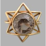 GOLD RING  Gold ring with head made into the shape of six-point star, set in the middle with