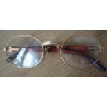 A pair of Cartier 18k gold and rosewood framed glasses, Model 140b, No. 1773521, lens diameter 53mm,