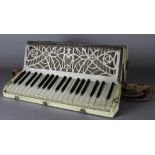 A 20th Century Casali of Verona cream pearlised Lucite cased piano accordian, with pierced metal