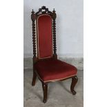 A Victorian rosewood nursing chair, with turned finials, spiral turned uprights, back and seat