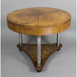 A 1950’s figured walnut and chromed metal circular coffee table of Art Deco design, the top with