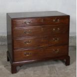 A George III mahogany chest of drawers of small proportions, fitted four long graduated drawers on