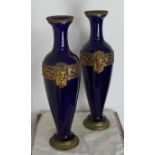 A pair of 19th Century French blue glazed porcelain and ormolu mounted baluster shaped vases in