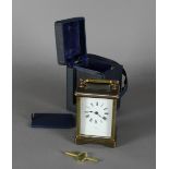 A late 19th/early 20th Century French carriage timepiece retailed by Craddock of Glasgow, with white