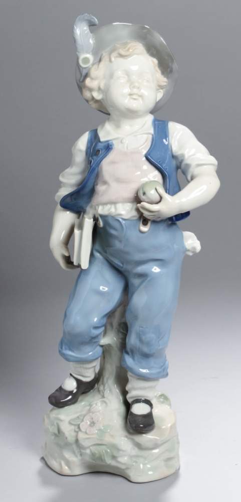 Porzellan-Figur, "Schuljunge", Thüringen, 2. Hälfte 20. Jh., auf Natursockel mitBlüten-Blattrelief