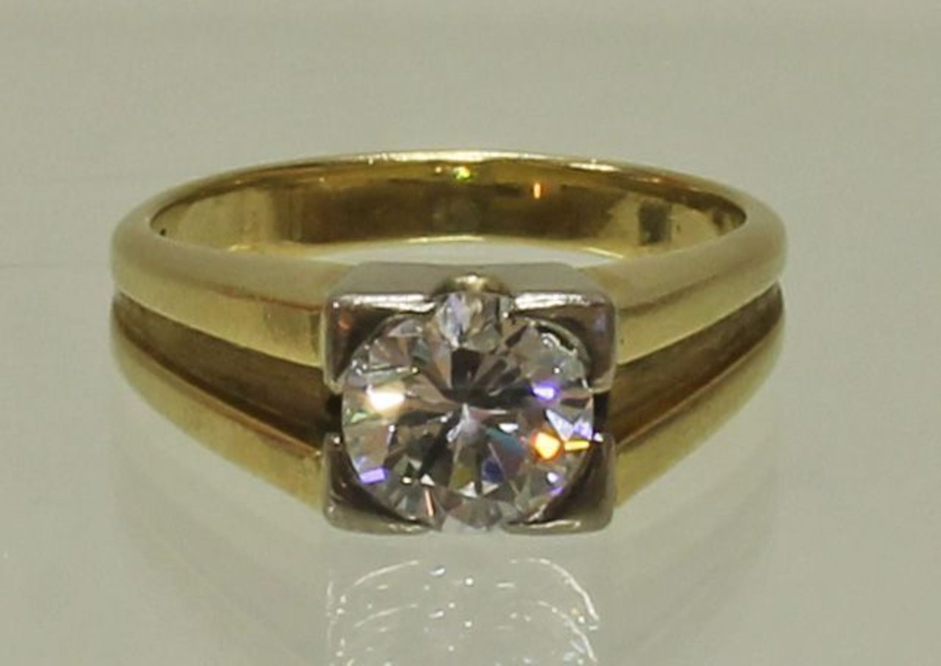 Reserve: 4000 EUR        Solitärring, WG/GG 585, 1 Brillant ca. 1.25 ct., etwa w (H)/vs1,