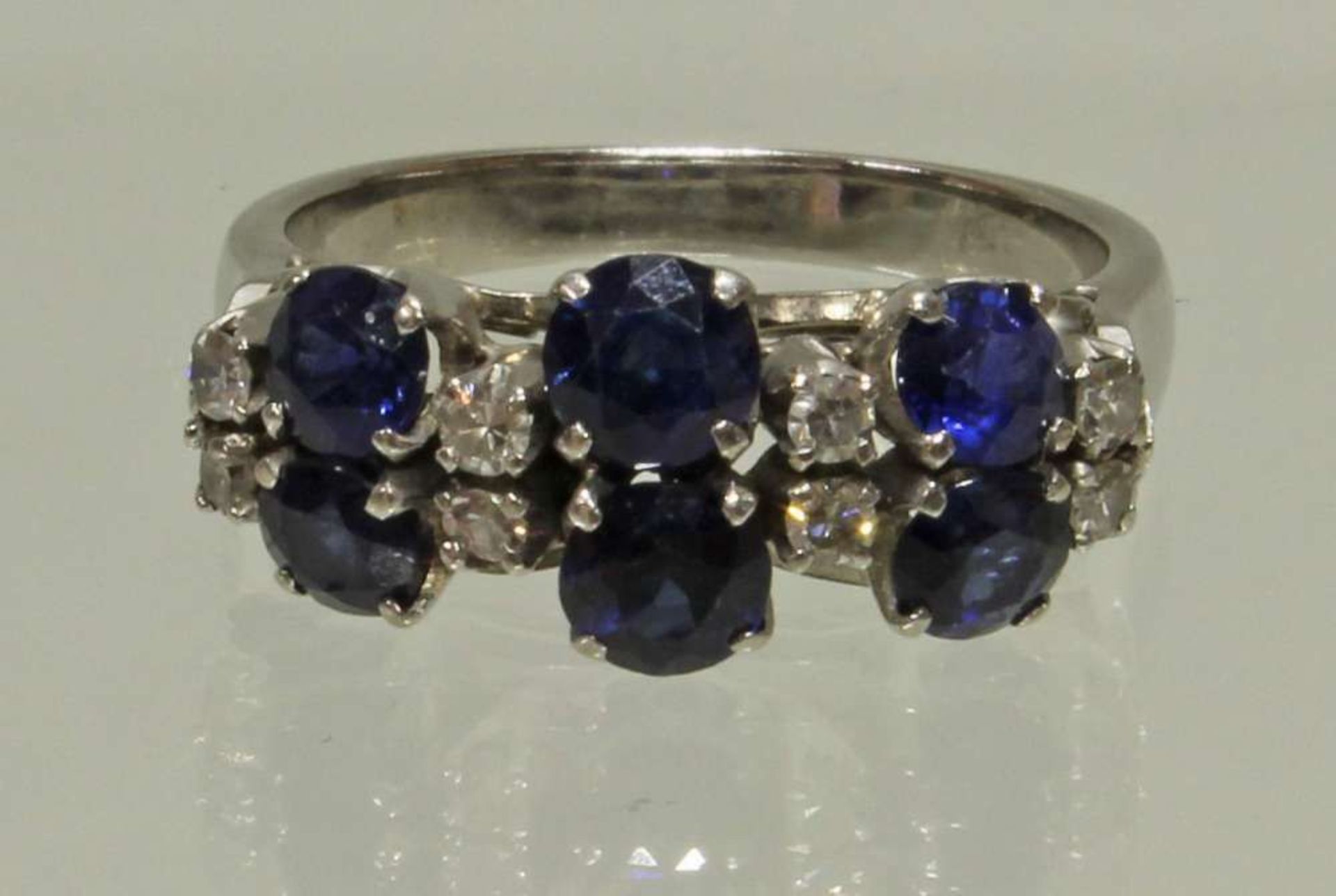 Reserve: 180 EUR        Ring, WG 333, 6 runde facettierte Saphire, 8 Achtkant-Diamanten zus. ca. 0.