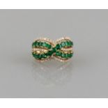 Ring 18ct. yellow gold, jewelled with 25 emeralds of good quality, total 2.75 ct. and 63 small