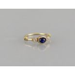 Ring 18ct. yellow gold with an oval saphire and two small diamonds, size 56, weight 2.7 gr., perfect