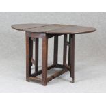 Gateleg table Oval oak gateleg table with hinged sides, raised on block supports, open 126 x 96