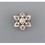 Pendant/brooch 14ct. white gold with one large diamond H/vvsi-if 1.00 ct., five diamonds H/if, 0.