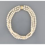 Pearl neclace Choker of three rows with143 pearls, 14ct. gold locker with eight diamonds, pearls