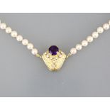 Pearl neclace Choker of 55 selected pearls, unusual14ct. gold locker with eight diamonds and large
