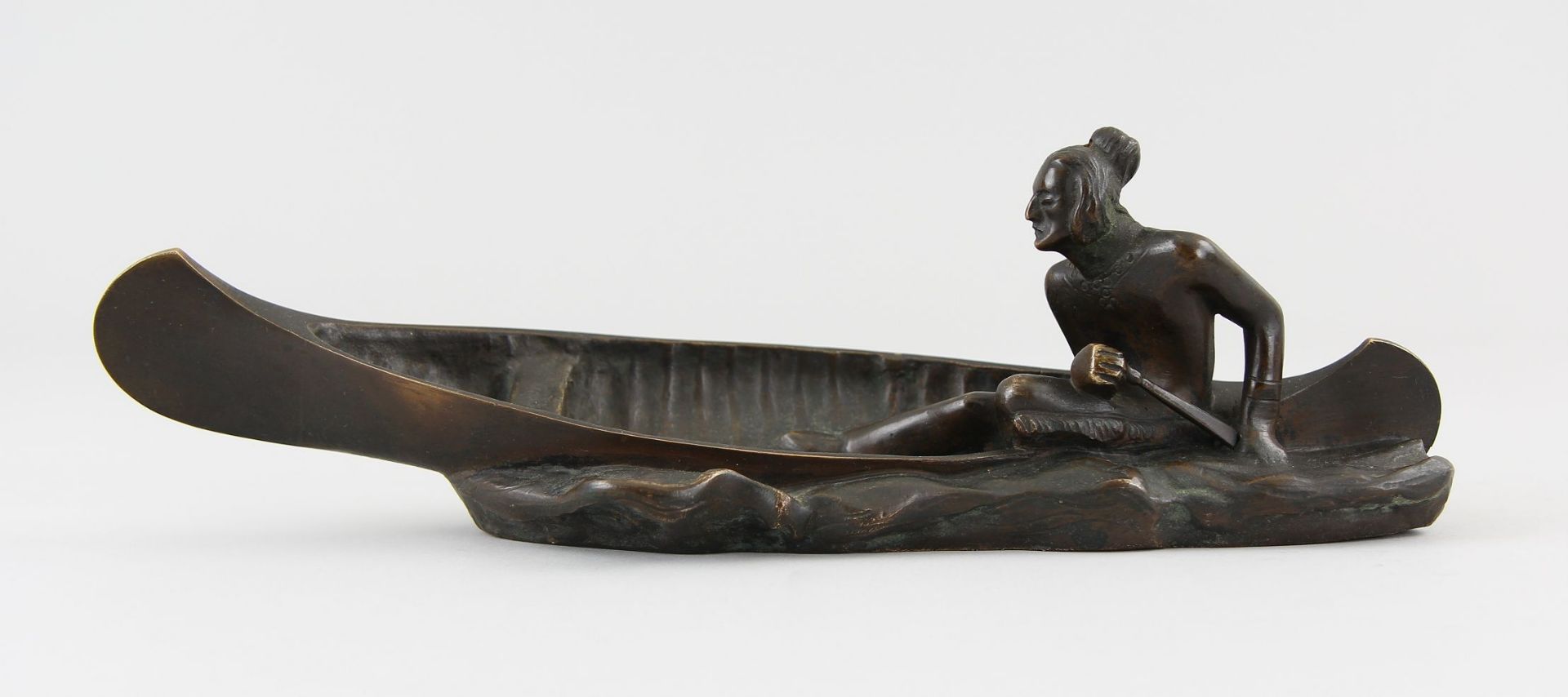 German or Austrian Sculptor of the 19th/20th century Figure, patinated bronze, canoeing Native