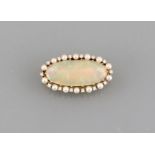 Brooch 18ct. yellow gold, large moon stone with 14 small diamonds and 14 small pearls, 38 x 21 mm,