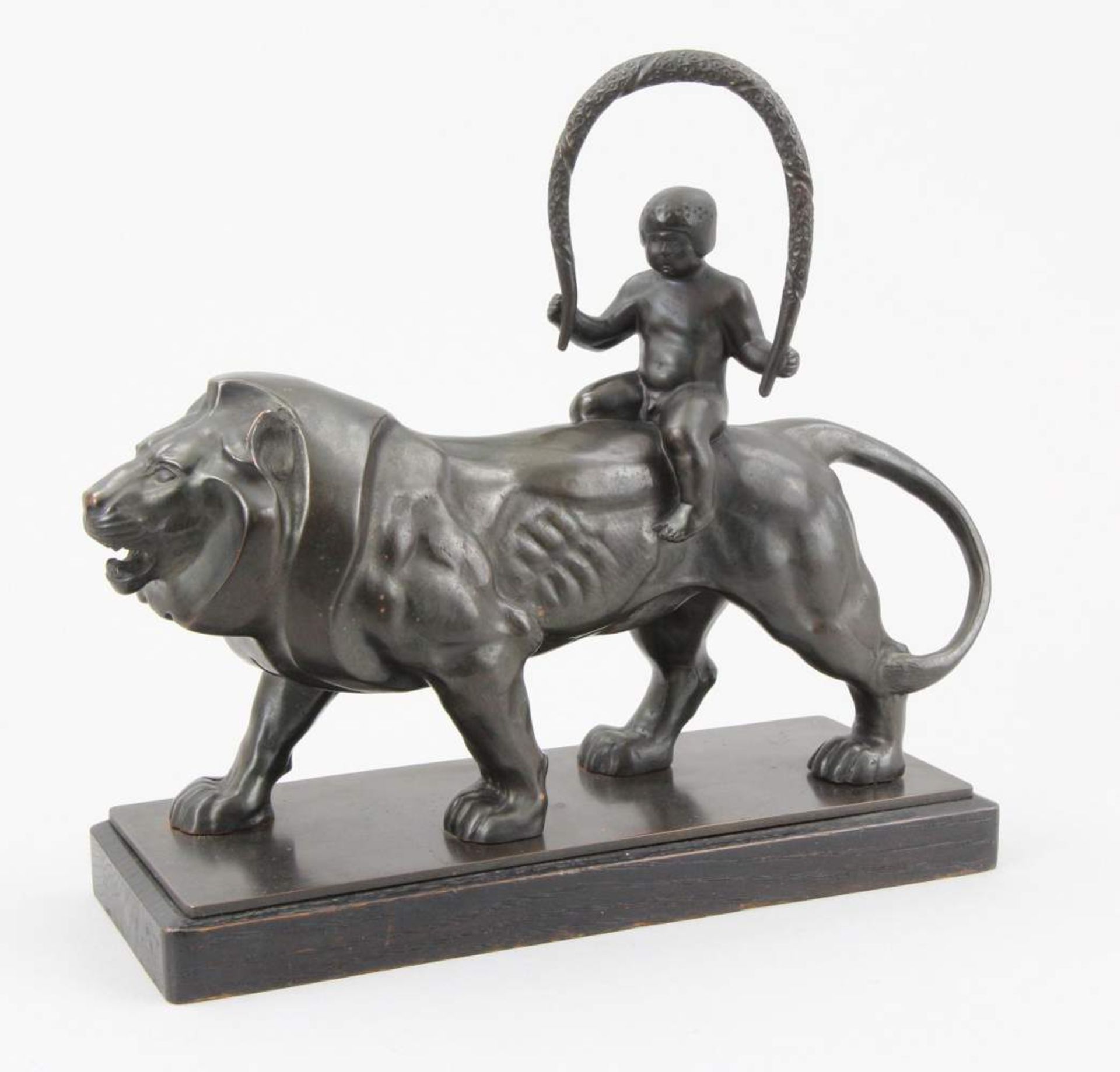 Germn early 20th century sculptor Figure, patinated bronze, naked boy riding a lion, original wooden - Image 2 of 3