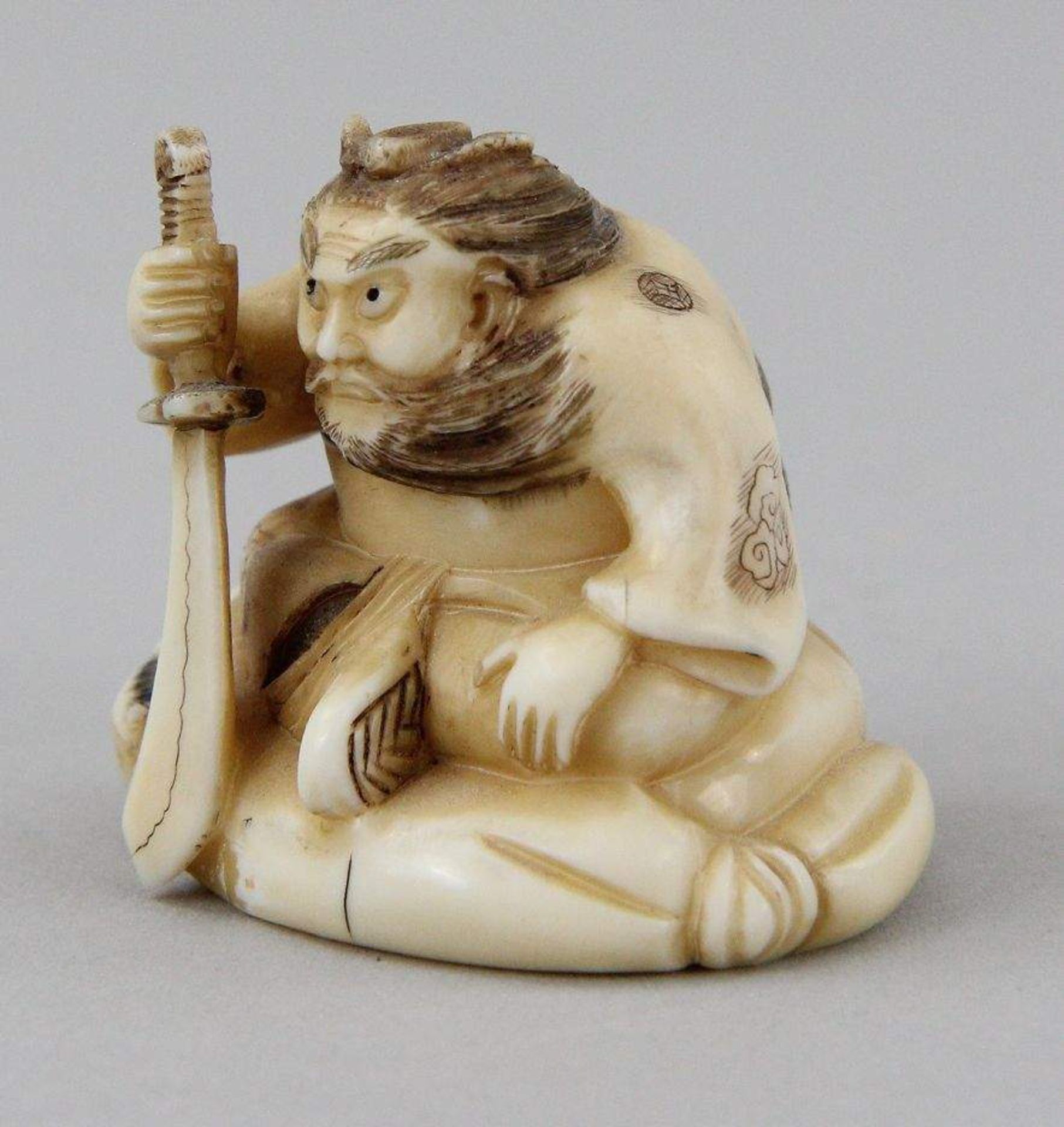 Netsuke "Sh?ki with Oni" Carved and partly coloured walrus tooth, sitting Sh?ki on a large - Image 2 of 5