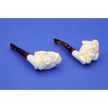 2 Meerschaumpfeifen,detailreich geschnittene Araberköpfe mit Turban, bernsteinfarbene Mundstücke,