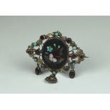 Austro Hungarian silver set Petra Dore brooch, the border set with turquoise and almandine garnet,