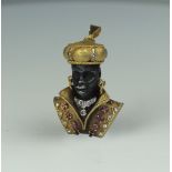 A ruby diamond pendant depicting a Blackamoor, signed MISSIAGIL with various gold marks for 18ct