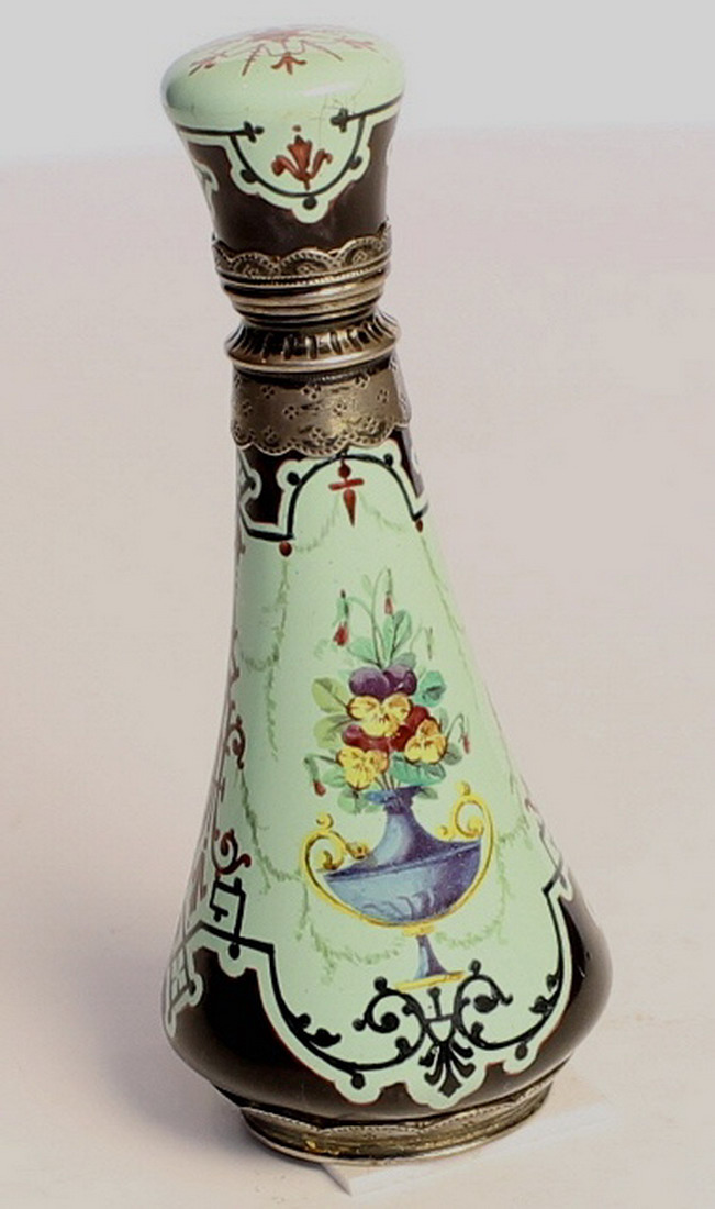 A French Enamel perfume bottle, silver mounts to the neck and base , decorated with flowers