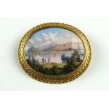 A Swiss Gold and Enamel Brooch Painted with a view of a lake signed on the reverse Mt Rossel Baute