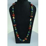 Lampwork, lapis lazuli, sponge coral, 18 carat gold and jade bead necklace by Abigail Sands.