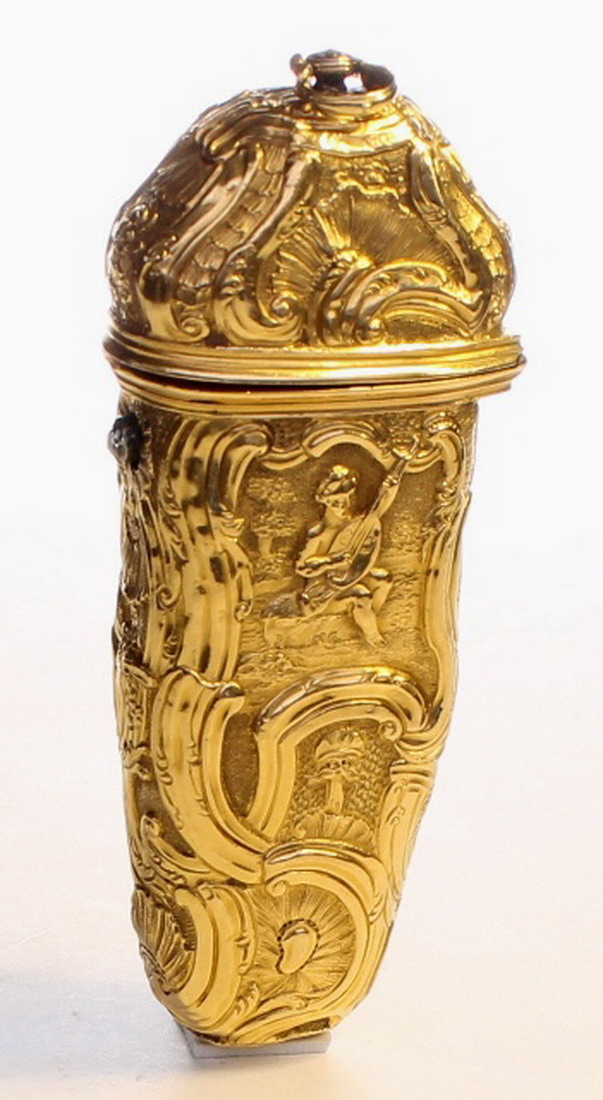 A Gold repousse etui, fitted with scissors, writing slip ,knife, tweezers, ear spoon and pencil.