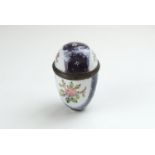 A fine Bilston enamel nutmeg grater with lilac ground white vignettes covered in summer flowers