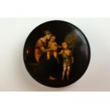 This beautiful circular stockman papier mache snuff box shows a mother and her two young children,