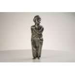 Silver figure of a  standing Turk with arm crossed chest the other across back   opening at waist to