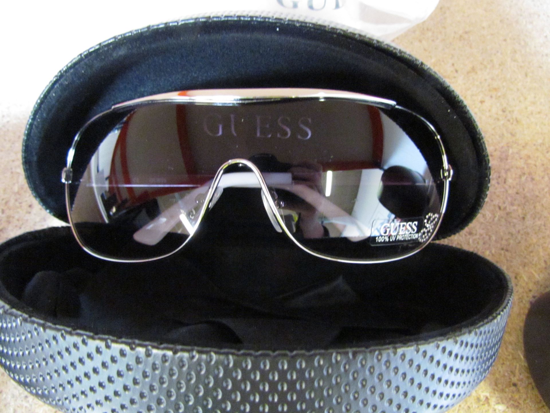 ladies designer sun glasses by guess