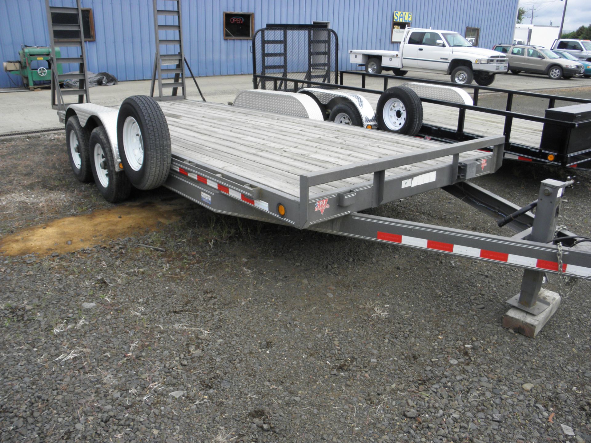 2008 PJ 18' tandem axle flatbed trailer w/fold up ramps, 7K lb axles, 6â€ sub frame