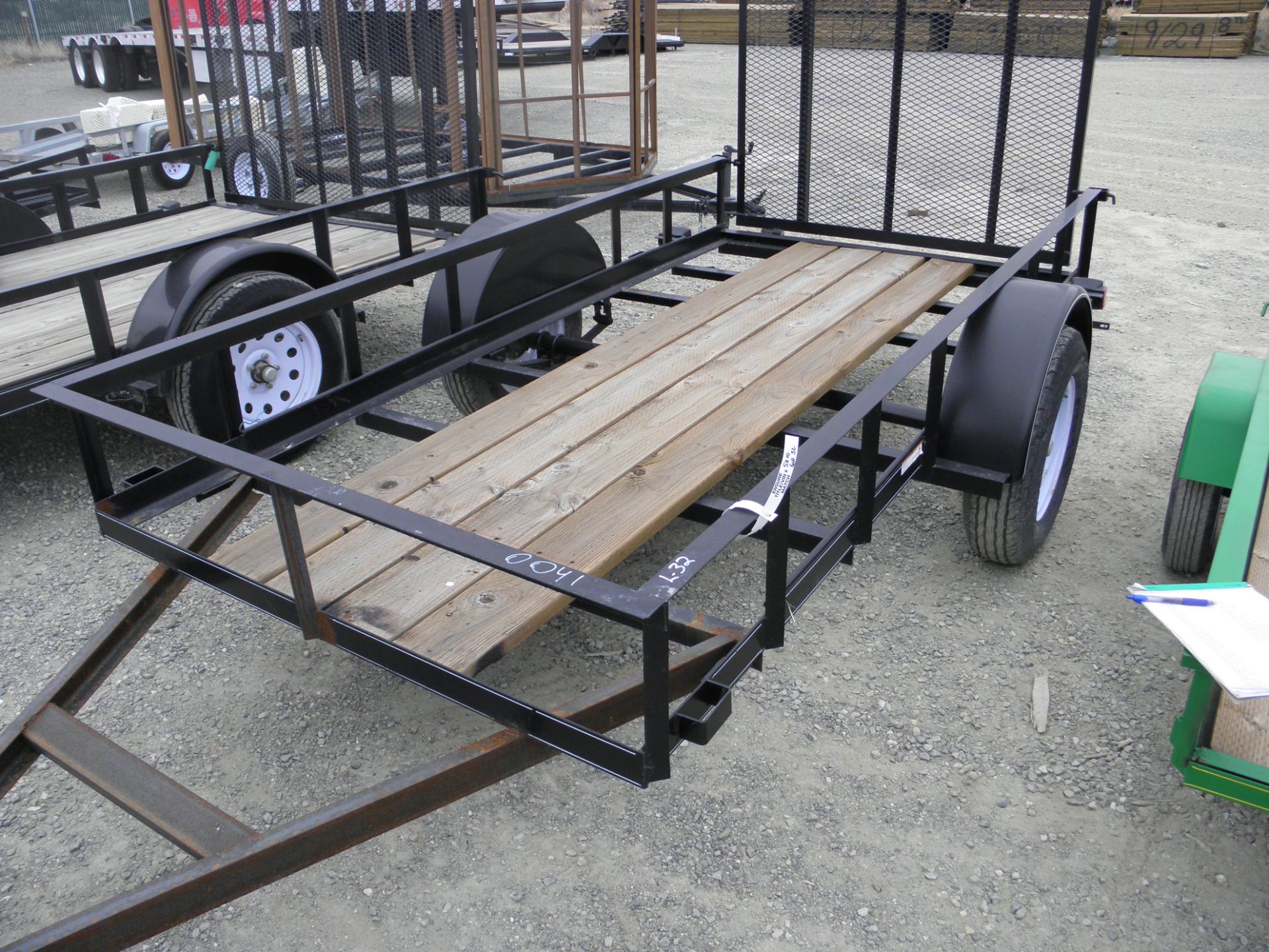 5' X 10' single axle flatbed, rail sides, rear fold up ramps(unfinished)