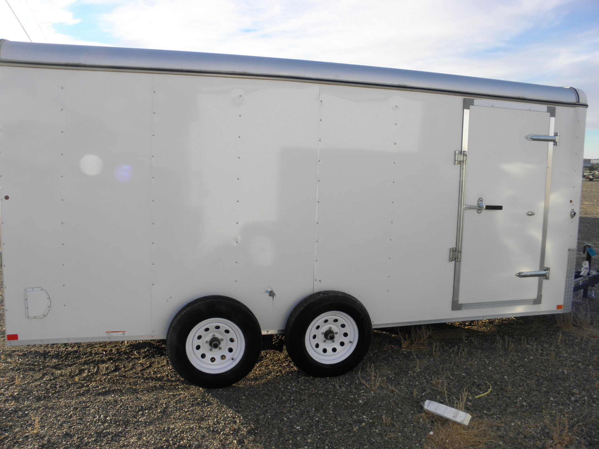 2015 7' X 14' tandem axle enclosed cargo, fold down rear door, side door, no fender