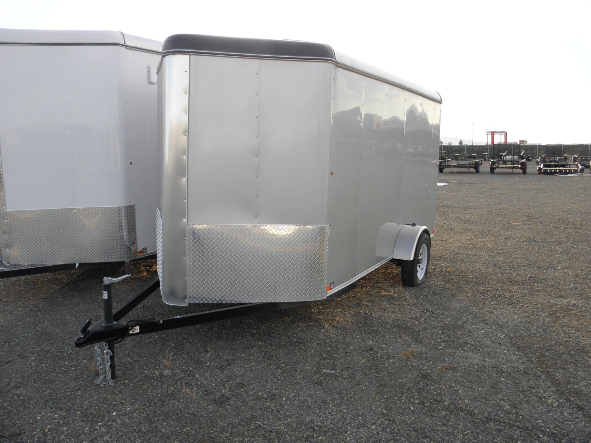 6' X 12' single axle enclosed cargo, fold down rear door, wood lined, V nose, silver