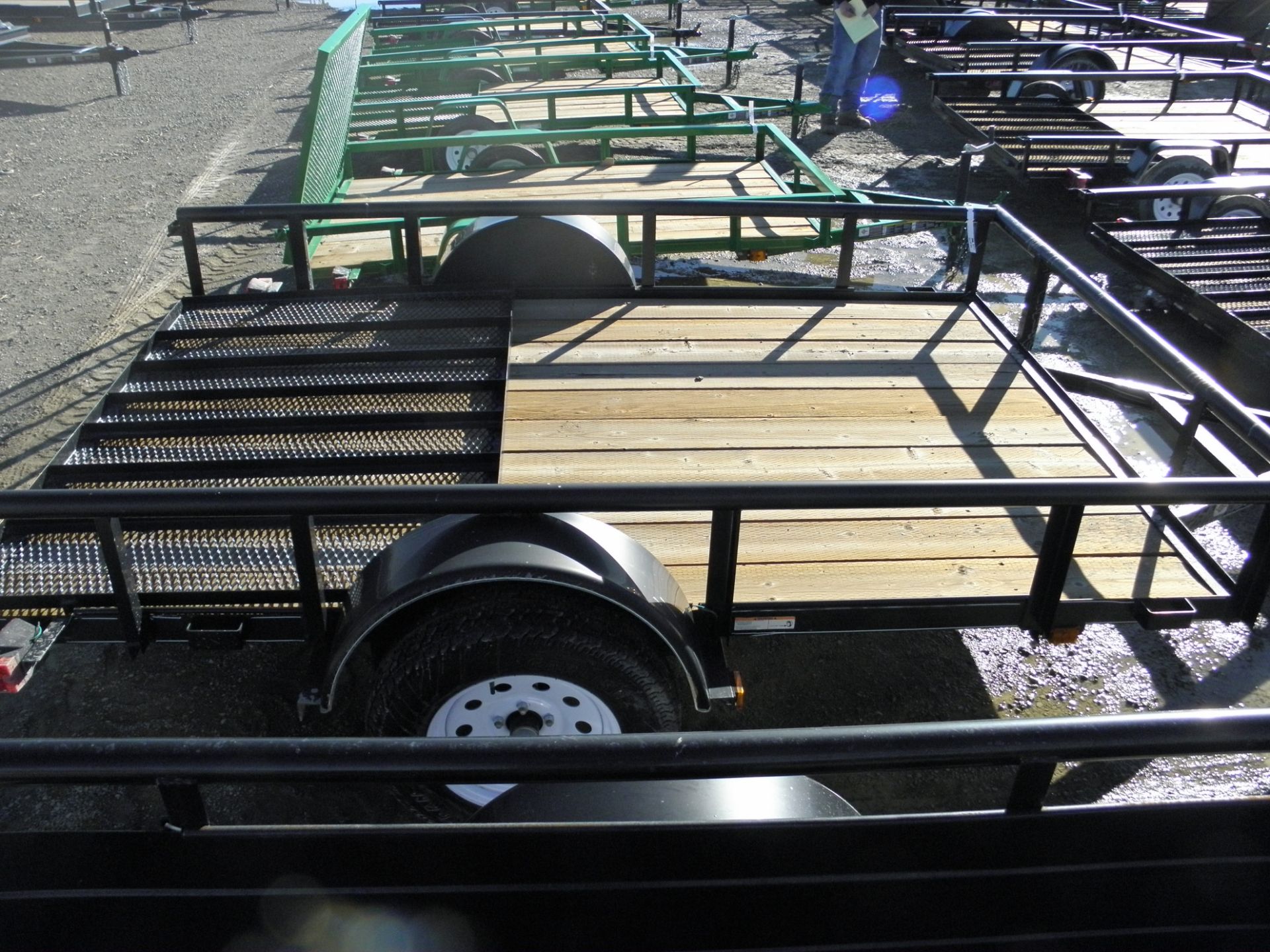 6' X 10' single axle flatbed, pipe rail, expanded metal fold up ramp, wood deck