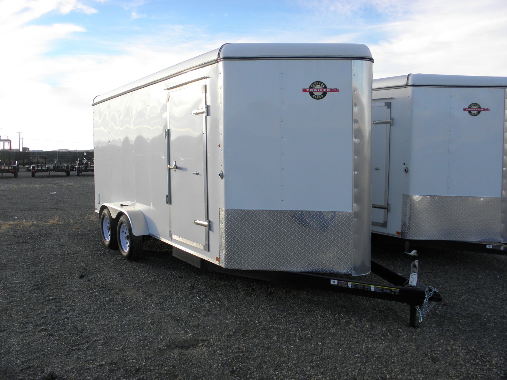 2012 7' X 16' tandem axle enclosed cargo, fold down rear door, side door, V nose, 7' tall