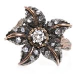 Star - shaped Elizabethan style ring Gold and silver, central brilliant cut diamond, 0.16 cts and