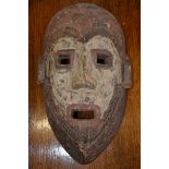 Tribal Art - an African mask, scarified