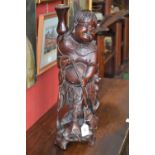 A Chinese hardwood figural lamp, carved
