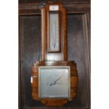 An Art Deco oak aneroid barometer, c.193