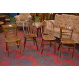 Two beech spindle back dining chairs; tw