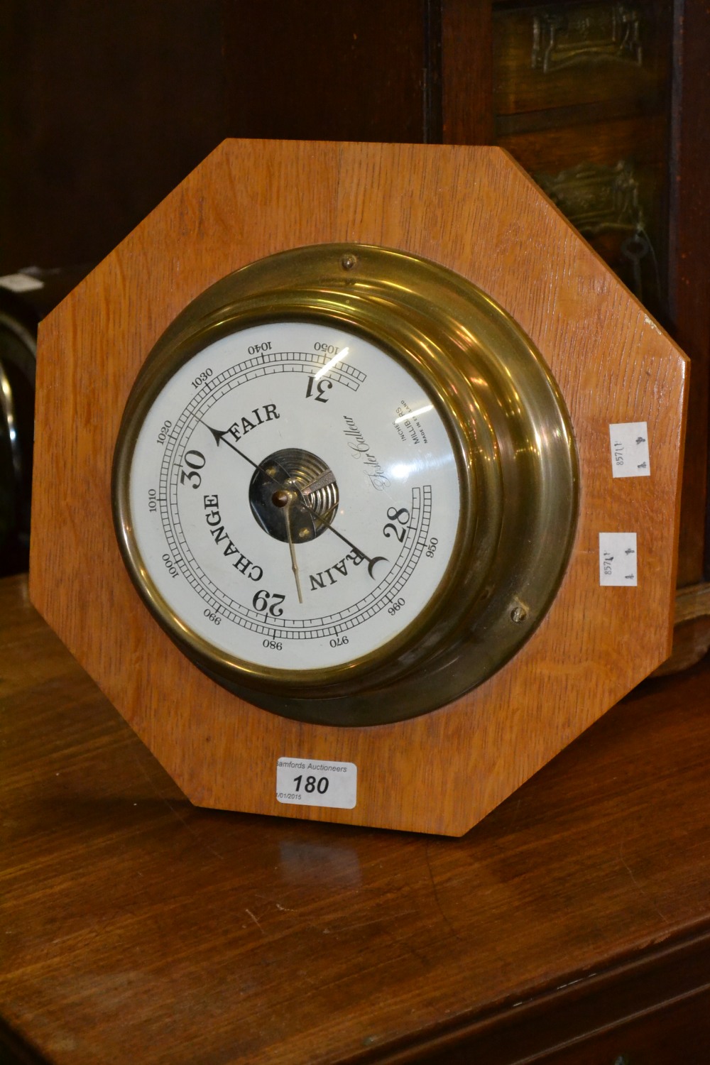 A brass barometer, Foster Callear, octag