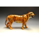A Beswick model of a tiger, 30cm wide, p