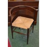 An Arts and Crafts corner chair, the bac