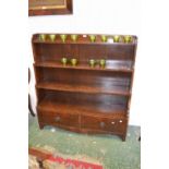 A mahogany four tier waterfall bookcase,